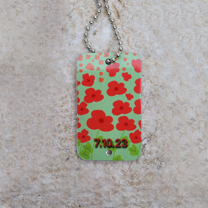 army-dog tag-red flowers-kidnapped-october-irit-luvaton